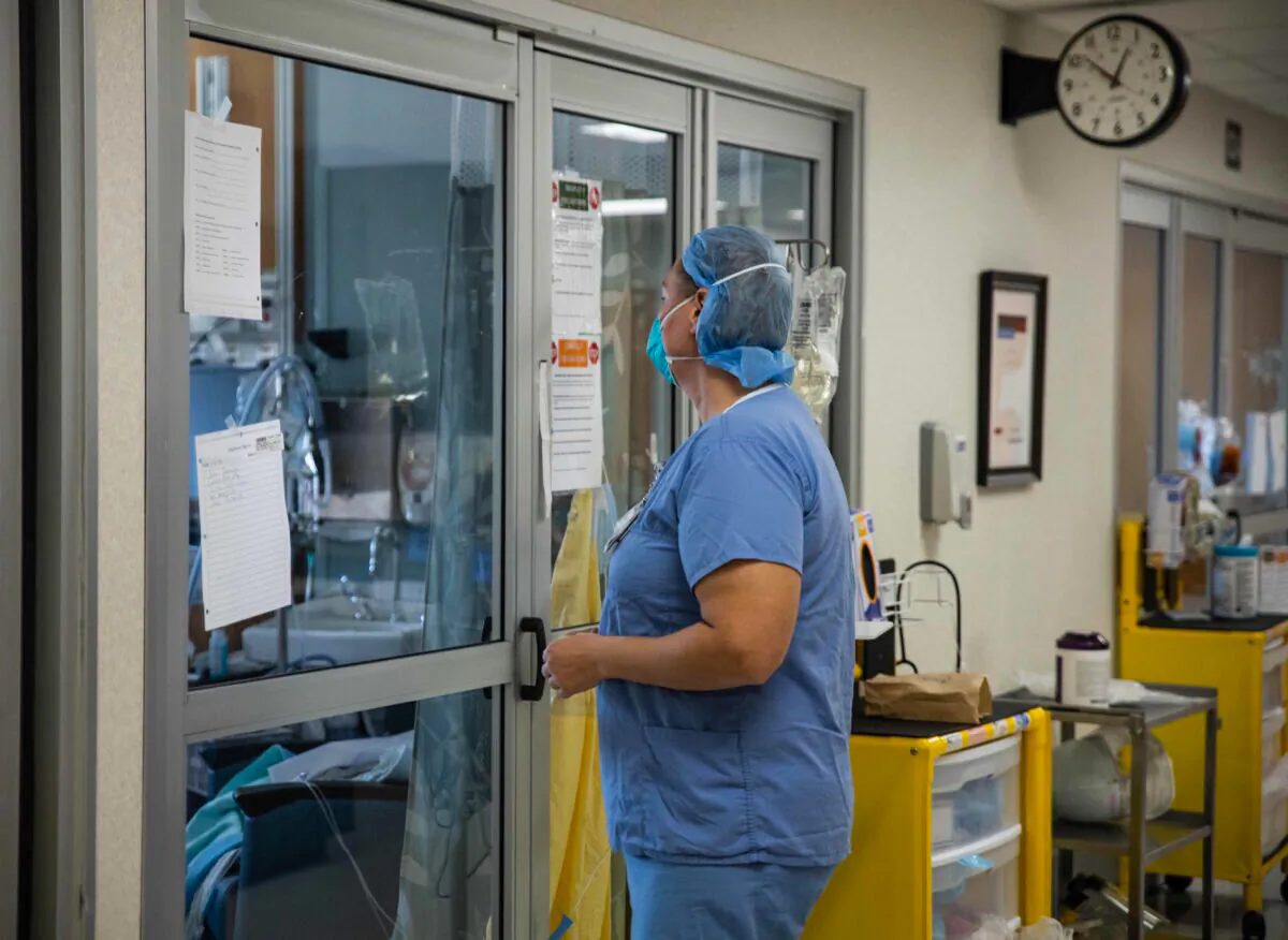 A healthcare professional prepares to enter a COVID-19 patient's room in the ICU at Van Wert County Hospital in Van Wert, Ohio, on Nov. 20, 2020. (Megan Jelinger/AFP via Getty Images)