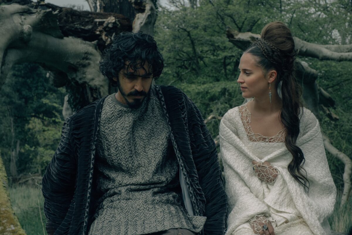 mand and woman in woods in The Green Knight