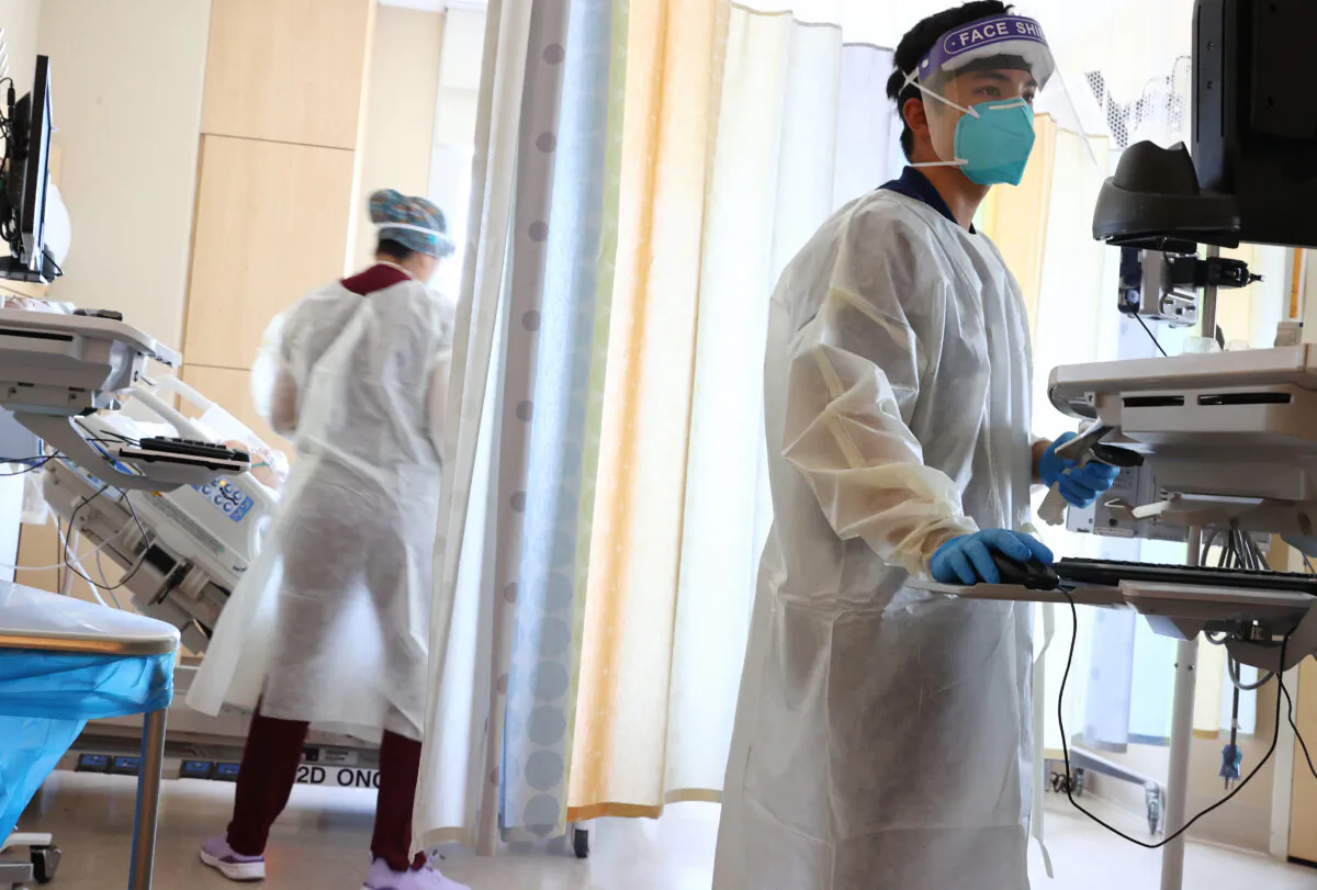 Clinicians care for COVID-19 patients in the improvised COVID-19 unit at Providence Holy Cross Medical Center in Los Angeles, Calif., on July 30, 2021. (Mario Tama/Getty Images)