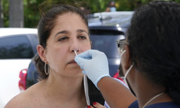 Raquel Heres gets a COVID-19 rapid test to be able to travel overseas, in North Miami, Fla., on July 31, 2021. (Marta Lavandier/AP Photo)