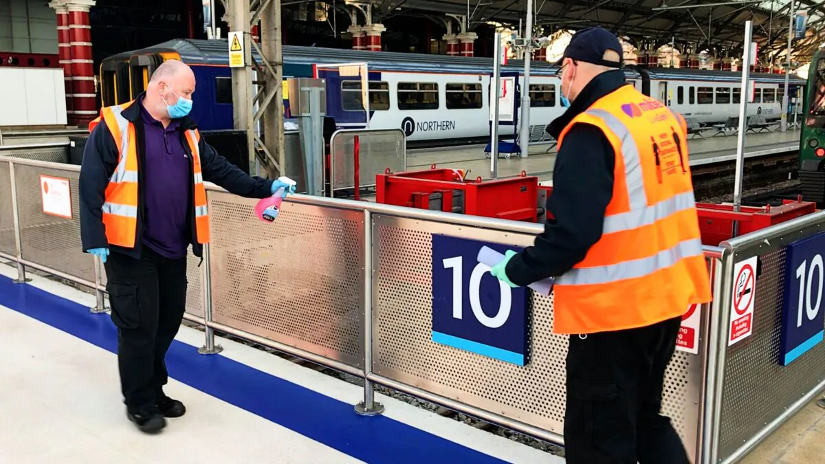 Handrails being cleaned at Liverpool Lime Street station, Liverpool, United Kingdom, in an undated handout photo. (Network Rail/PA)