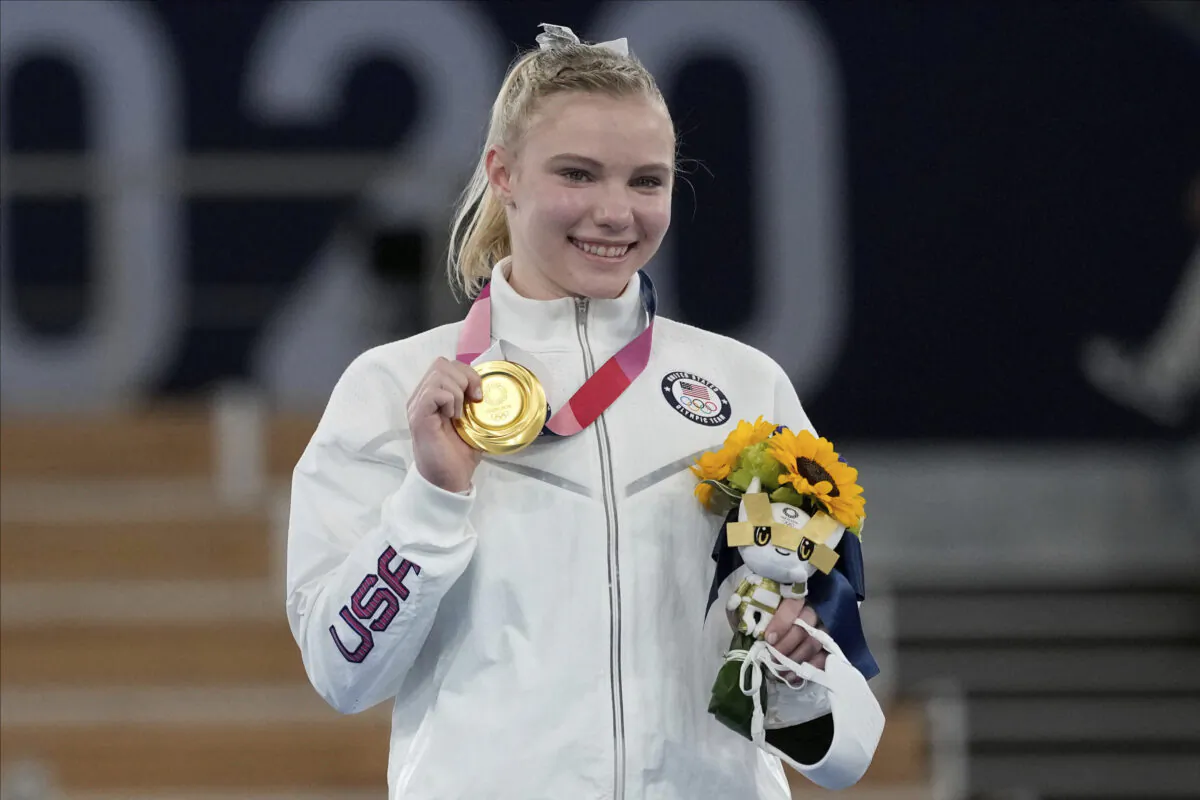 Jade Carey, of the United States, poses after winning the gold medal for the floor exercise during the artistic gymnastics women's apparatus final at the 2020 Summer Olympics in Tokyo, Japan, on Aug. 2, 2021. (Ashley Landis/AP Photo)
