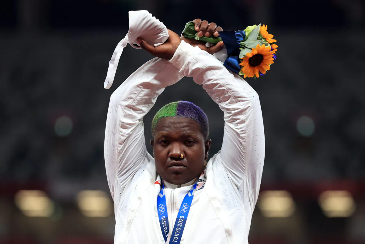 Raven Saunders of the United States gestures on the podium after winning silver in shot put at the Tokyo Olympics in Tokyo on Aug. 1, 2021. (Hannah Mckay/Reuters)