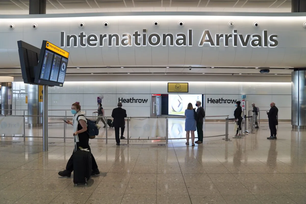 Passengers in the international arrivals hall at Terminal 2 of London Heathrow Airport, in London, UK, on July 29, 2021. (Steve Parsons/PA)