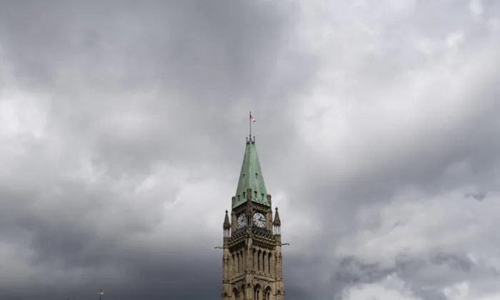 Storm clouds pass by the Peace tower and Parliament hill Aug. 18, 2020 in Ottawa. (The Canadian Press/Adrian Wyld)