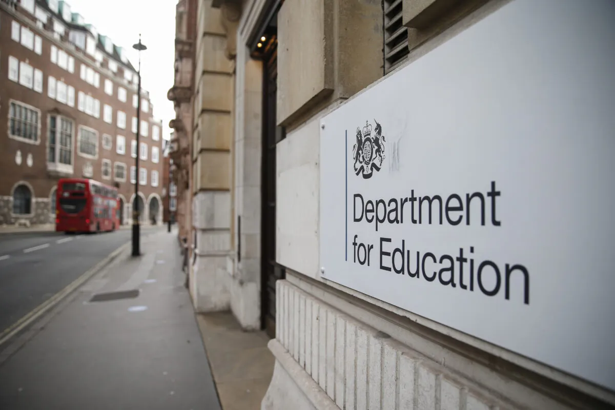 A London bus passes the Department of Education building in London, Britain, on Dec. 28, 2020. (Hollie Adams/Getty Images)