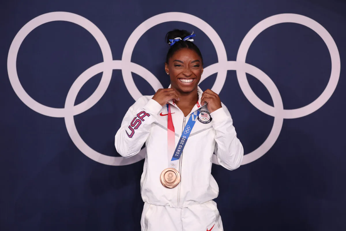 Simone Biles of Team USA poses with the bronze medal following the Women's Balance Beam Final on day eleven of the Tokyo 2020 Olympic Games at Ariake Gymnastics Centre on Aug. 3, 2021 in Tokyo, Japan. (Jamie Squire/Getty Images)