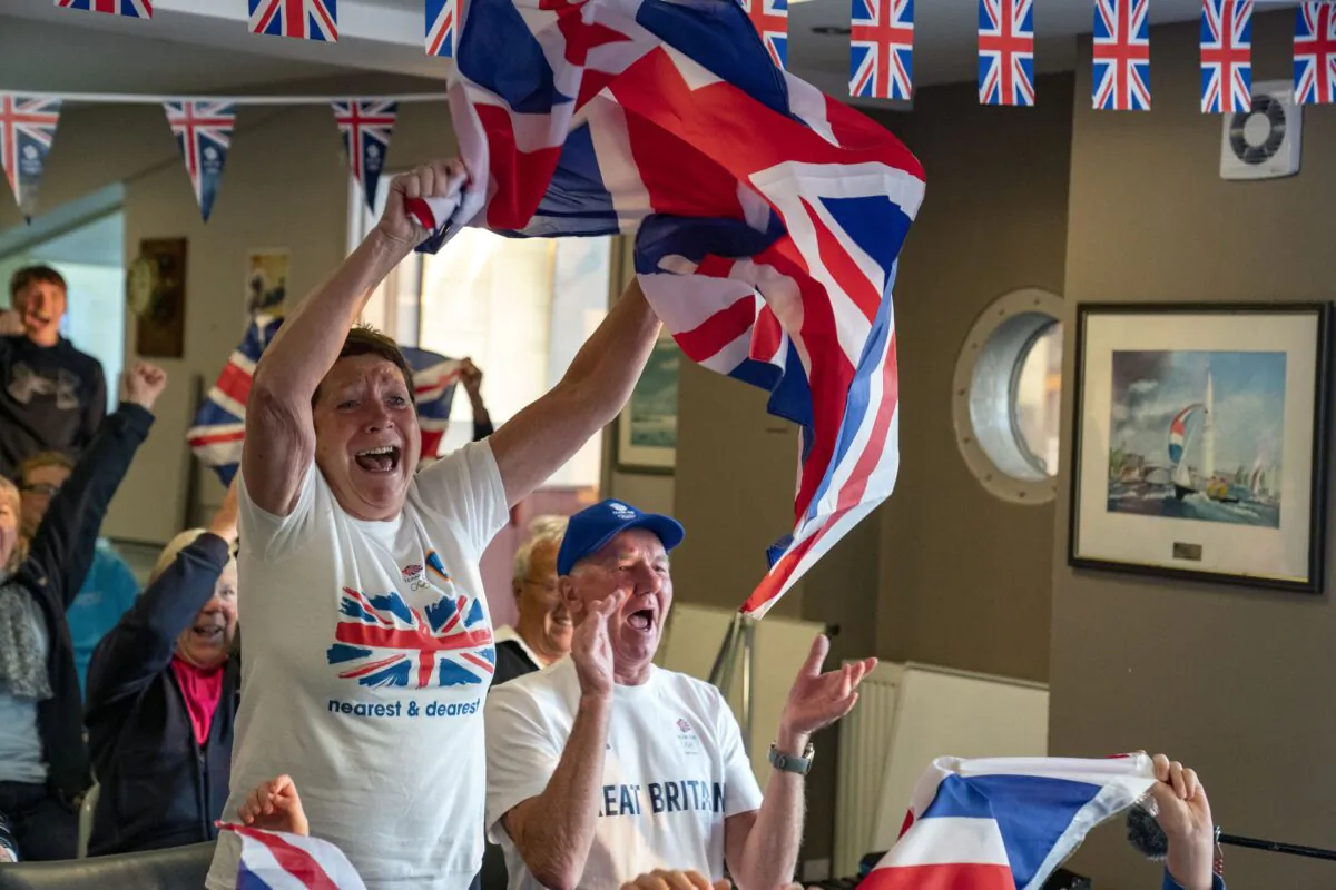 Vivian and Leslie Bithell watch their son Stuart Bithell and his helm Dylan Fletcher win a gold medal in the 49er medal race at Tokyo 2020 Olympic Games, Tokyo, on Aug. 3, 2021. (Peter Byrne/PA)