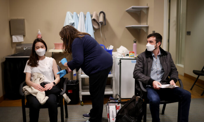 United Airlines flight attendants receive COVID-19 vaccines at United's onsite clinic at O'Hare International Airport in Chicago, Ill., on March 9, 2021. (Scott Olson/Getty Images)