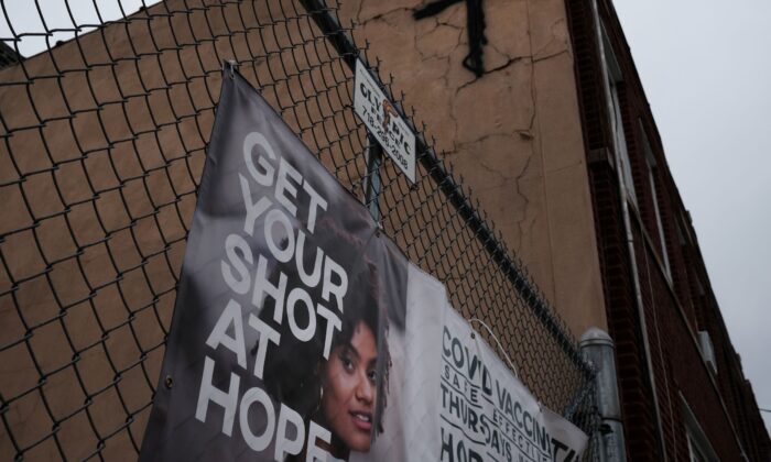 A sign asks people to get the COVID-19 vaccine in a Brooklyn neighborhood which is witnessing a rise in COVID-19 cases in New York City, on July 13, 2021. (Spencer Platt/Getty Images)