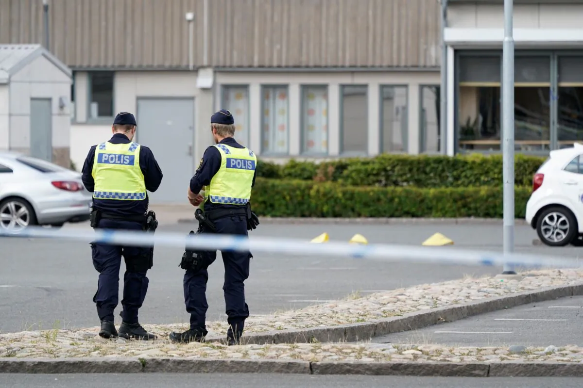 Police stand at the scene of a shooting incident, in the Nasby area, of Kristianstad, Sweden, on Aug. 3, 2021. (Johan Nilsson/TT News Agency via AP)