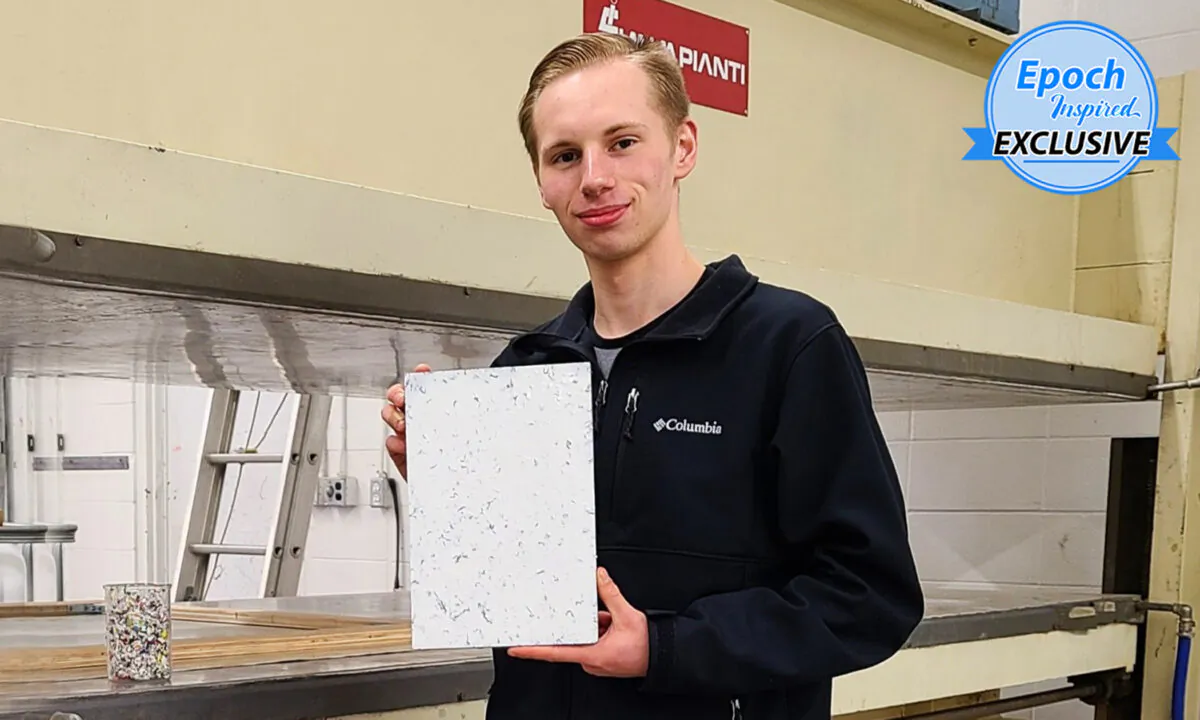 Myles Peterson, 18, CEO and founder of the Terracore Plastic Company, holds a Terra-Panel plywood alternative board. (Courtesy of Myles Peterson)
