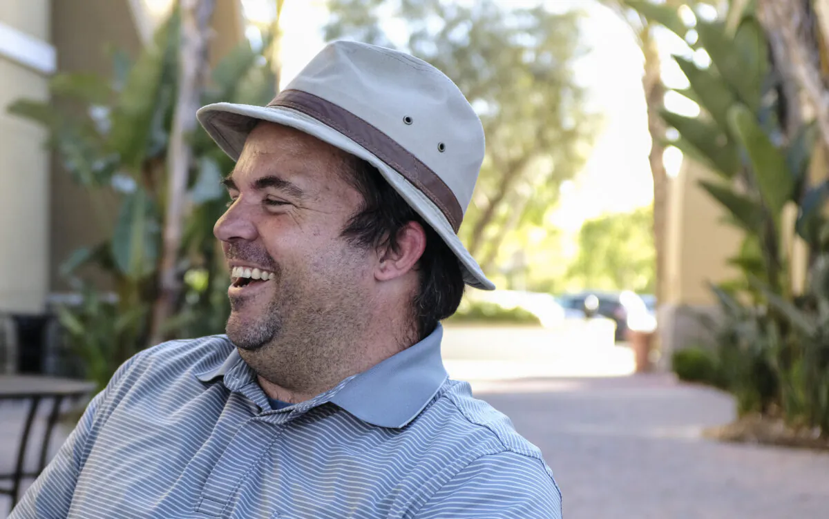 Byron Remeyer, 33, laughs over a cup of coffee in Rancho Santa Margarita, Calif., on June 18, 2021. (John Fredricks/The Epoch Times)