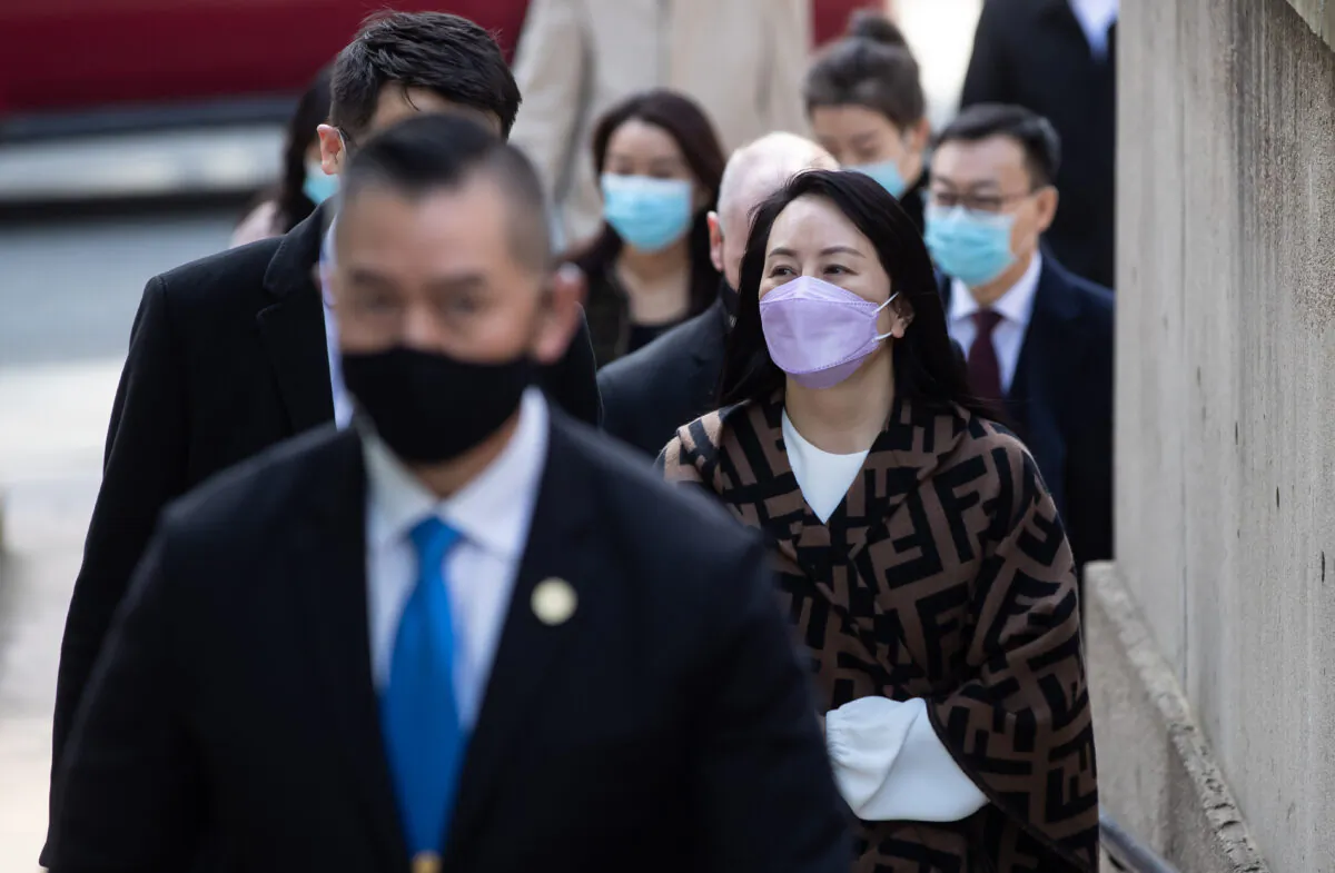 Meng Wanzhou, right, chief financial officer of Huawei, returns to B.C. Supreme Court after a break from her extradition hearing, in Vancouver, B.C., on March 31, 2021. (The Canadian Press/Darryl Dyck)