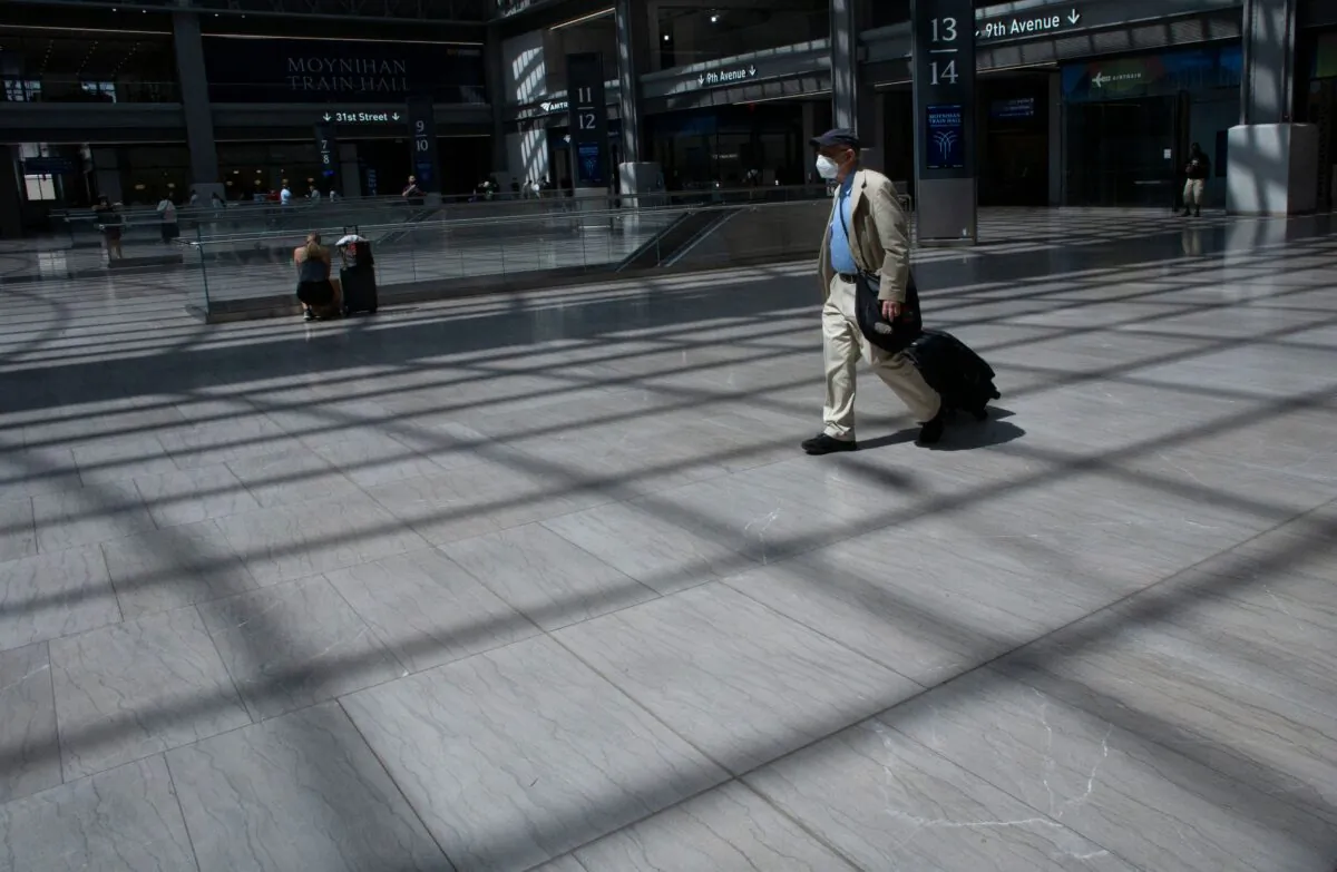 A man wears a mask as he arrives at Penn Station in New York on Aug. 2, 2021. (Kena Betancur/AFP via Getty Images)