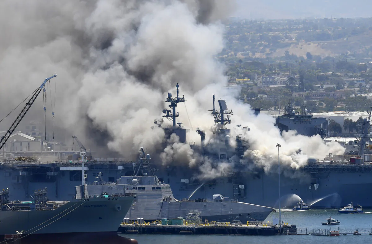 Smoke rises from the USS Bonhomme Richard in San Diego after an explosion and fire on board the ship at Naval Base San Diego in San Diego, Calif., on July 12, 2020. (Denis Poroy/AP Photo)