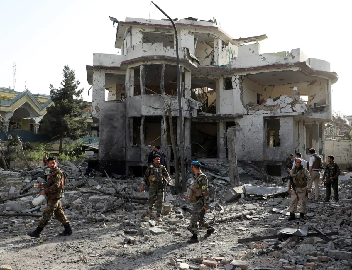 Afghan National Army (ANA) soldiers keep watch at the site of yesterday's night-time car bomb blast in Kabul, Afghanistan, on Aug. 4, 2021. (Stringer/Reuters)