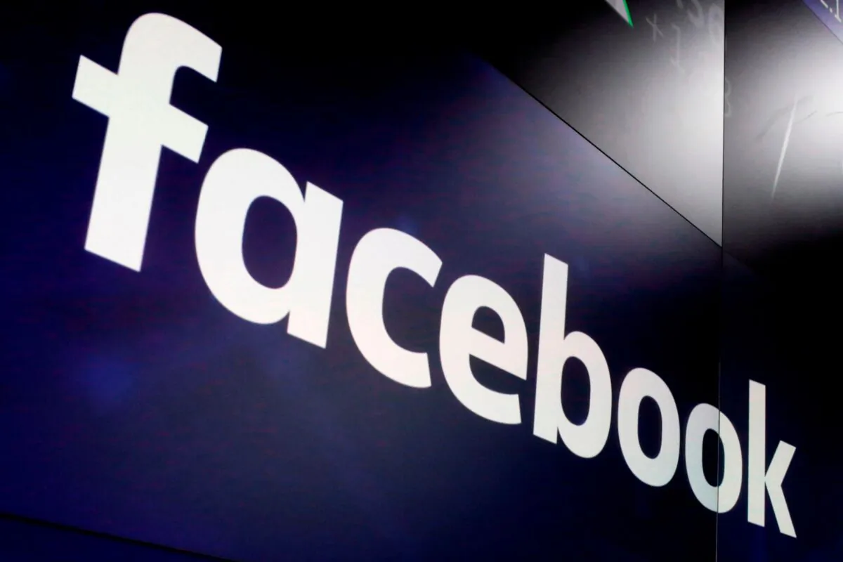 The logo for Facebook appears on screens at the Nasdaq MarketSite in Times Square, N.Y., on March 29, 2018. (Richard Drew/AP Photo)