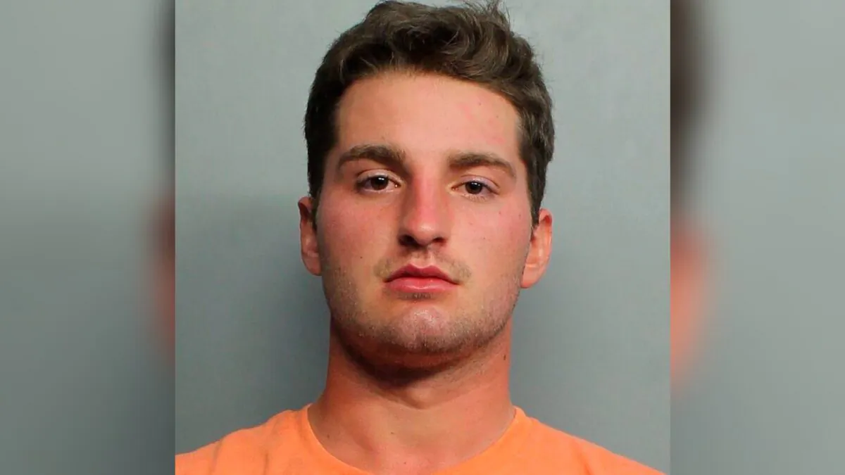 Maxwell Berry, 22, of Norwalk, Ohio, who was arrested at Miami International Airport and charged with three counts of misdemeanor battery, on July 21, 2021. (Miami-Dade Police Department via AP)