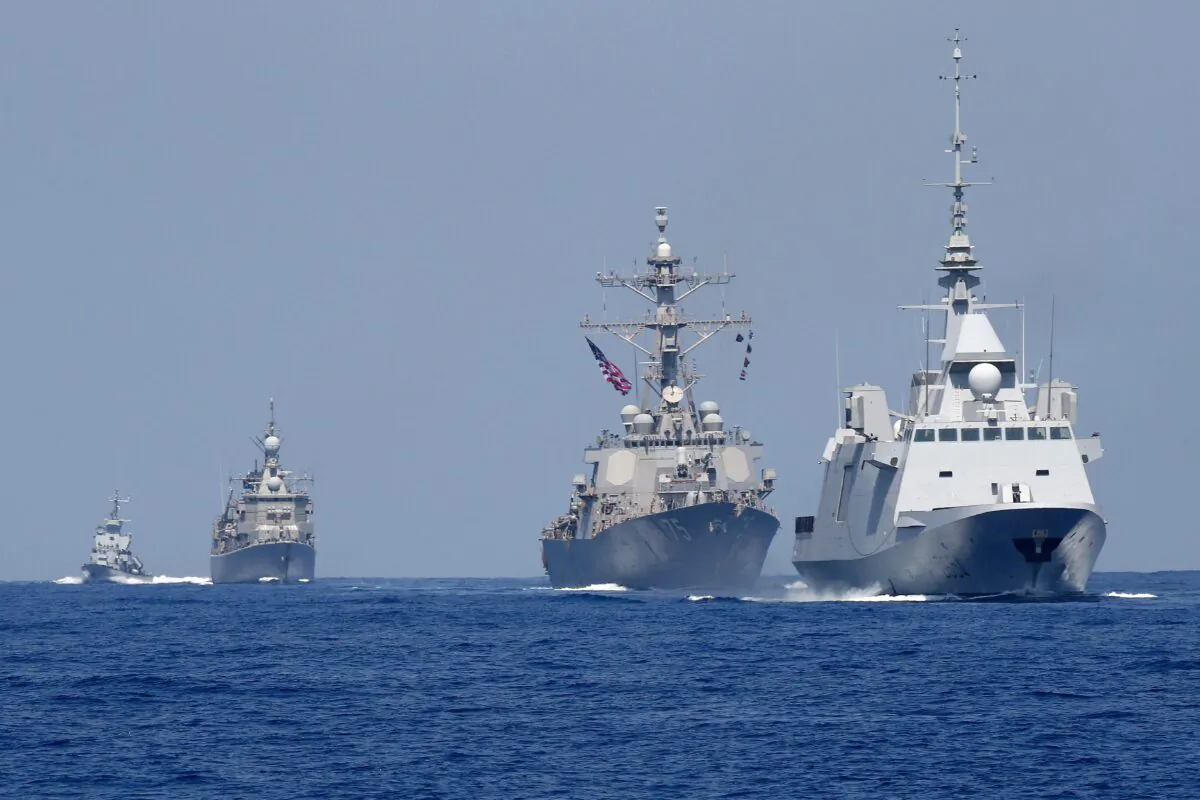 The French anti-submarine frigate FREMM Auvergne (R) and the U.S. Navy USS Donald Cook class guided missile destroyer (2R) and the Greek HS Aigaion frigate (2L) during an exercise how simulate a humanitarian response to a powerful earthquake and significant movement of IDF vessels and foreign vessels in the Mediterranean sea on Aug. 7, 2019. (Jack Guez/AFP via Getty Images)
