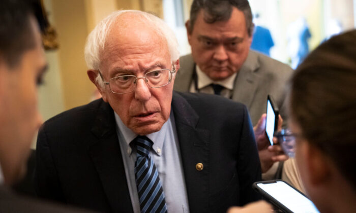 Sen. Bernie Sanders (I-Vt.) speaks to reporters after a lunch with President Joe Biden and Senate Democrats at the U.S. Capitol on July 14, 2021, in Washington. (Drew Angerer/Getty Images)