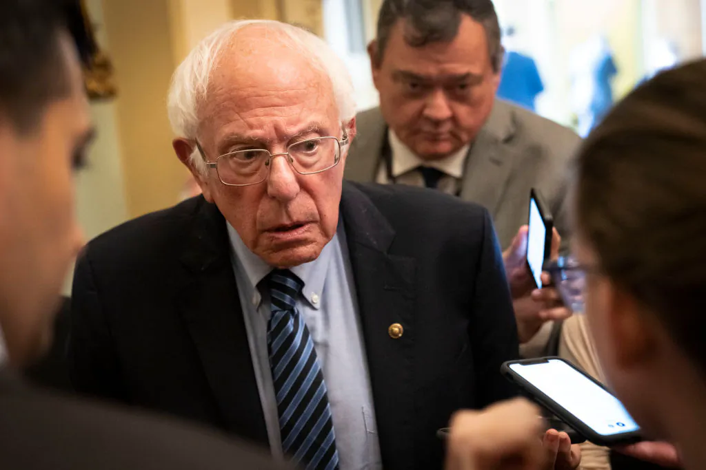 Sen. Bernie Sanders (I-Vt.) speaks to reporters after a lunch with President Joe Biden and Senate Democrats at the U.S. Capitol on July 14, 2021, in Washington. (Drew Angerer/Getty Images)
