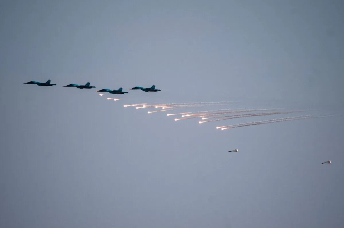Russian fighter jets drop bombs over the Ashuluk military base in Southern Russia during the "Caucasus-2020" military drills with China and Iran on Sept. 22, 2020. (Mitar Dilkoffl/AFP via Getty Images)