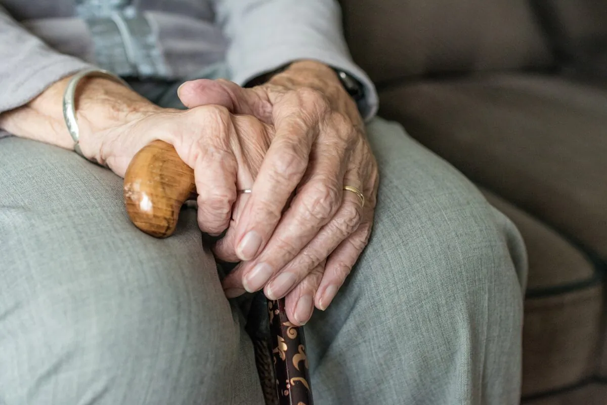 Stock photo of an elderly person holding a walking stick. (Sabine van Erp/Pixabay)