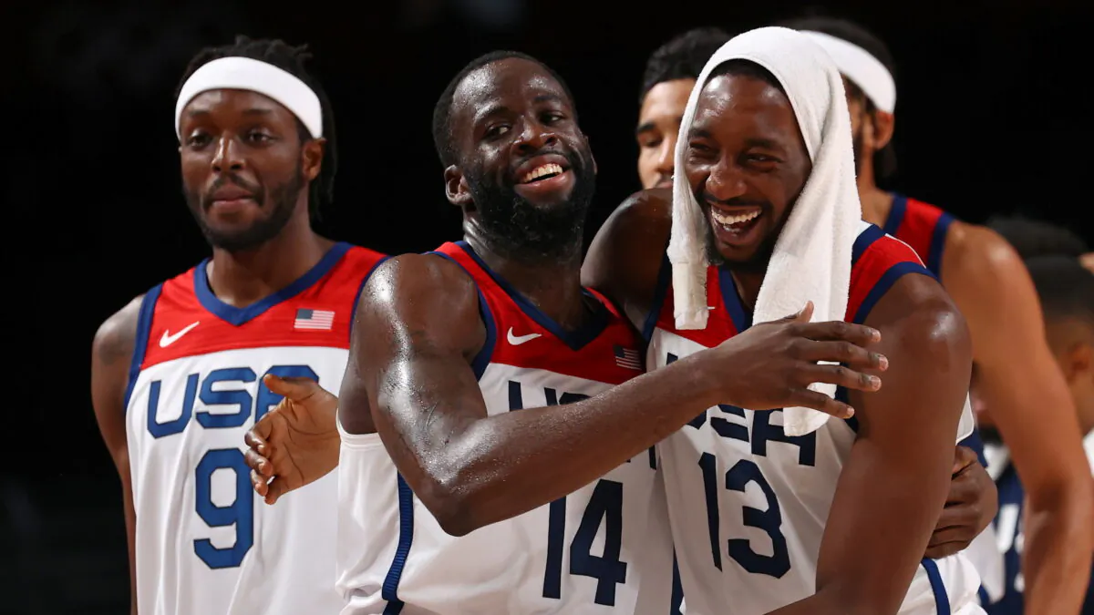 Draymond Green, center, and Bam Adebayo of the United States celebrate after beating Australia in Saitama, Japan, during the Tokyo Olympics on Aug. 5, 2021. (Brian Snyder/Reuters)