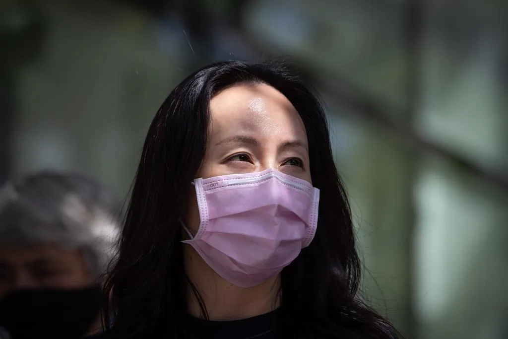 Meng Wanzhou, chief financial officer of Huawei, leaves B.C. Supreme Court during a break from her extradition hearing, in Vancouver, on August 5, 2021. (The Canadian Press/Darryl Dyck)