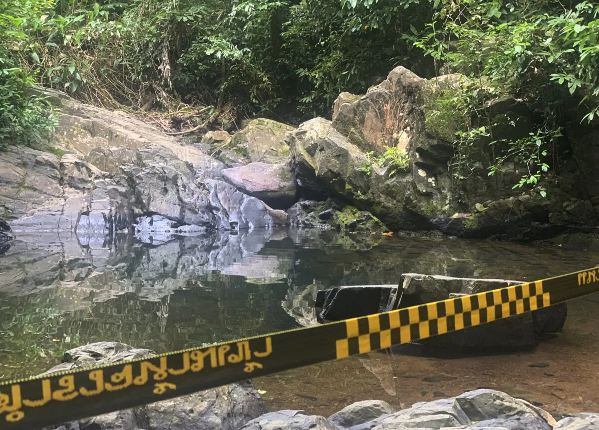 Police tape cordons off the area where a woman was found dead a day earlier at a secluded spot on the southern island of Phuket, Thailand, on Aug. 6, 2021. (AP Photo)