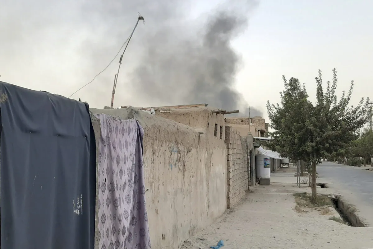 Smoke rises from the city of Lashkar Gah after an airstrike against the Taliban in Helmand province south of Kabul, Afghanistan on Aug. 6, 2021. (Abdul Khaliq/AP Photo)