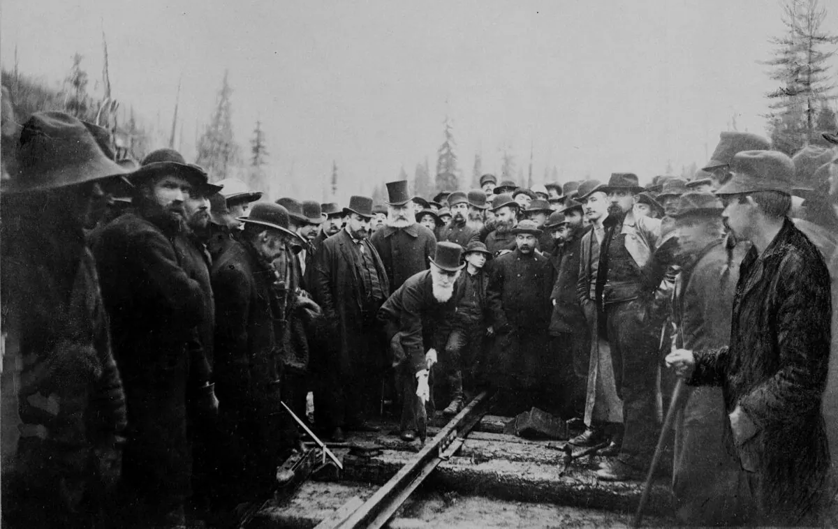 The Hon. Donald A. Smith drives home the last spike for the Canadian Pacific Railway in Eagle Pass, B.C., on Nov. 7, 1885. (The Canadian Press/National Archives of Canada)
