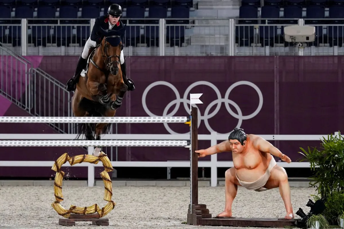 Britain's Harry Charles, riding Romeo 88, competes during the equestrian jumping individual qualifying at Equestrian Park in Tokyo at the 2020 Summer Olympics, Tuesday, in Tokyo, Japan on Aug. 3, 2021. (Carolyn Kaster/AP Photo)

