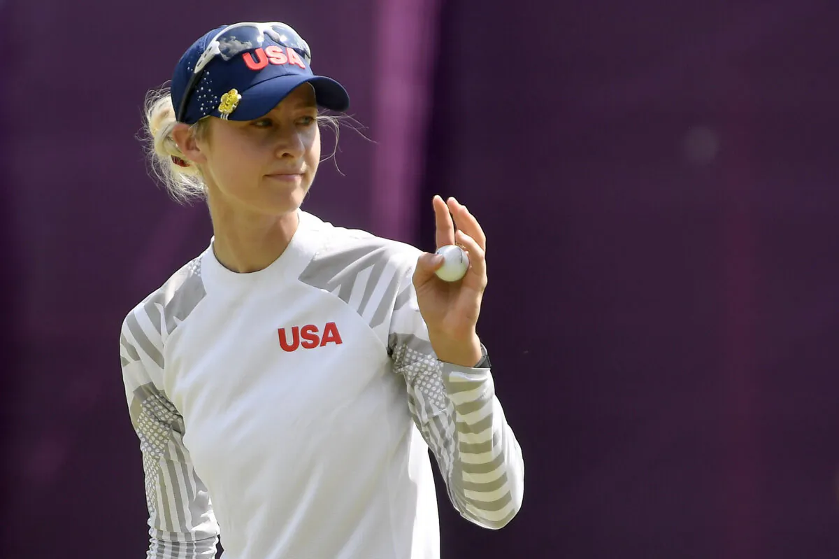 Nelly Korda of the United States gestures as she finishes her round 3 of the women's golf individual stroke play during the Tokyo 2020 Olympic Games at the Kasumigaseki Country Club in Kawagoe, Japan, on Aug. 6, 2021. (Toby Melville/Reuters)