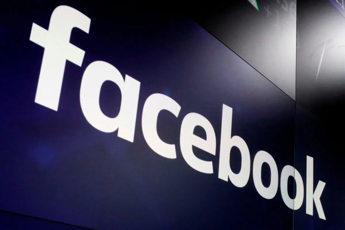 The logo for Facebook appears on screens at the Nasdaq MarketSite in New York's Times Square, on March 29, 2018. (Richard Drew/AP Photo)