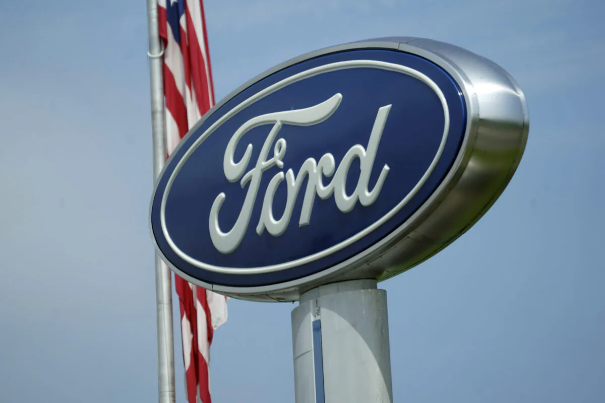 A Ford logo is seen on signage at Country Ford in Graham, N.C., on July 27, 2021. (Gerry Broome/AP Photo)