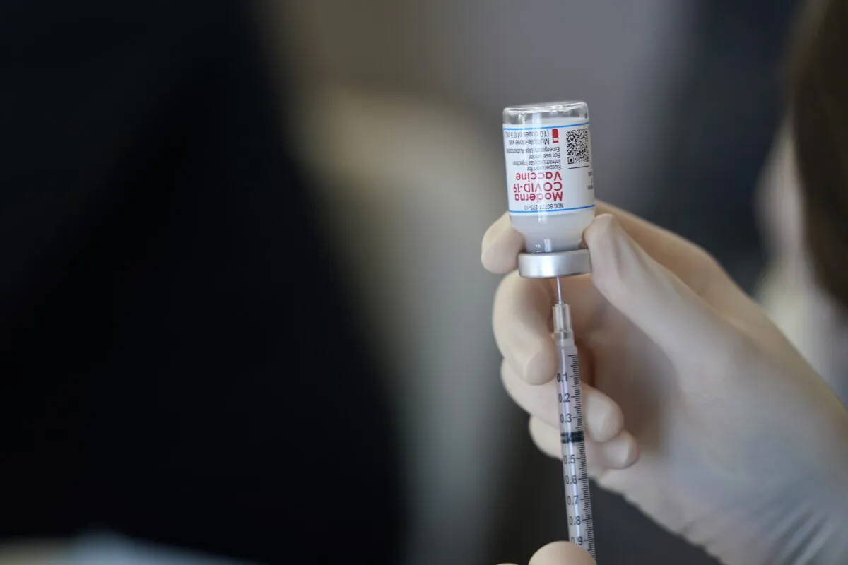 A worker readies syringes with the Moderna COVID-19 vaccine in Metairie, La., on March 29, 2021. (Gerald Herbert/AP Photo)