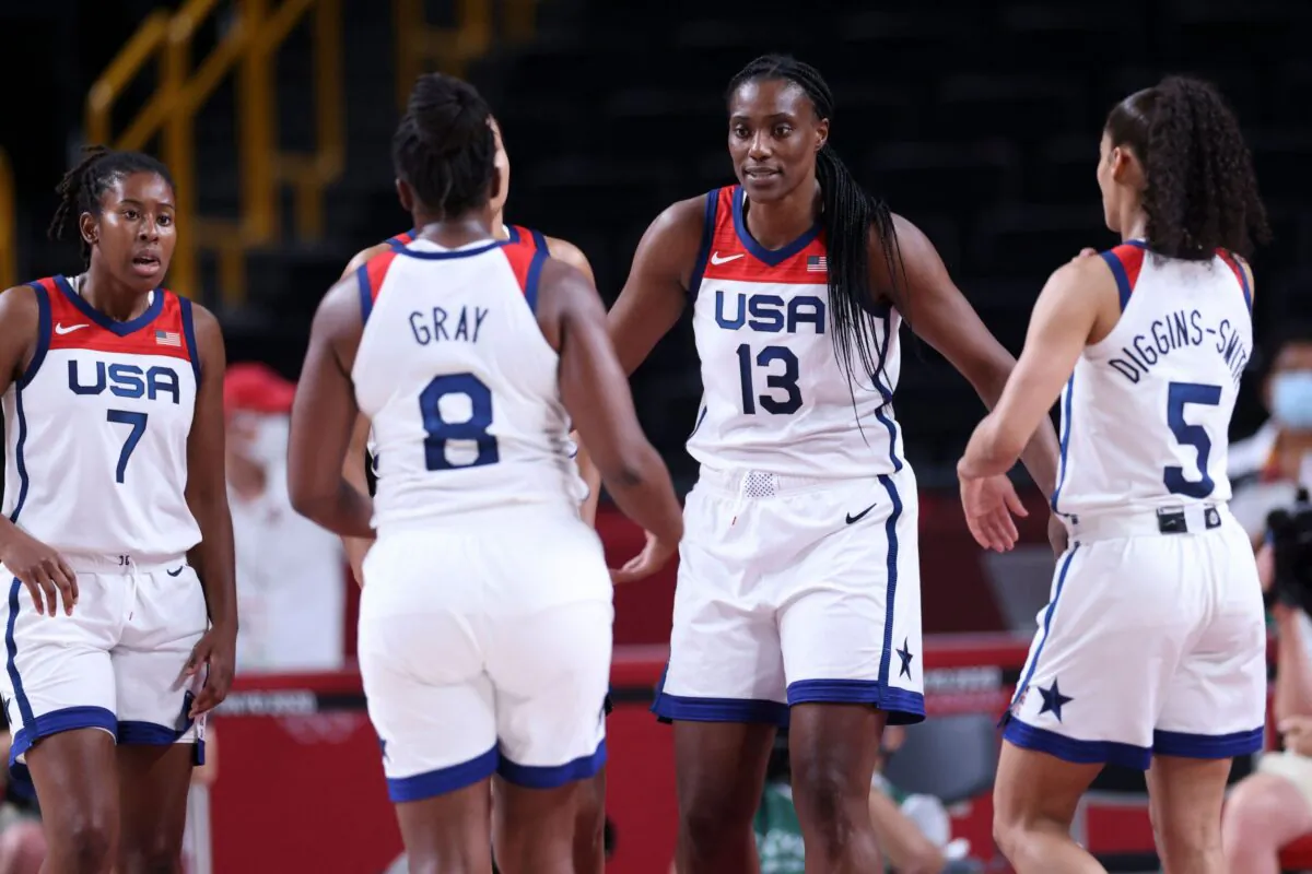 (From L) USA's Ariel Atkins, Chelsea Gray, Sylvia Fowles and Skylar Diggins react during the women's semi-final basketball match between USA and Serbia during the Tokyo 2020 Olympic Games at the Saitama Super Arena in Saitama, Japan, on Aug. 6, 2021. (Thomas Coex/AFP via Getty Images)
