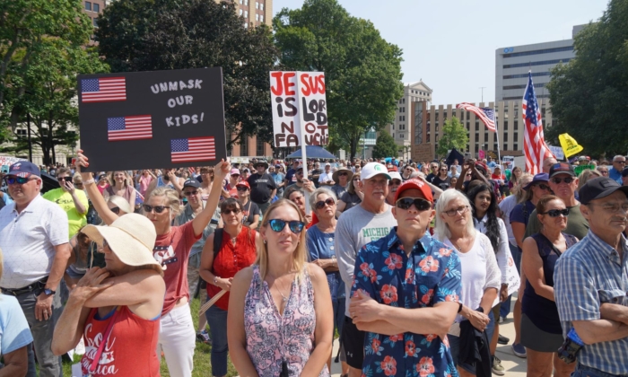 A view of part of the crowd protesting mandatory vaccinations and mask mandates at a rally at the State Capitol grounds in Lansing, Mich., on Aug. 6, 2021. (Steven Kovac/Epoch Times)