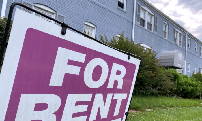 A "For Rent" sign is displayed in front of an apartment building in Arlington, Va., on June 20, 2021. (Will Dunham/Reuters)