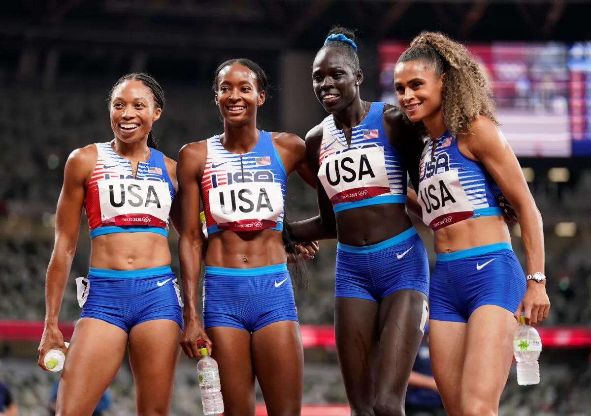 (L–R) The United States team of Allyson Felix, Dalilah Muhammad, Athing Mu, and Sydney Mclaughlin, celebrate winning the gold medal in the final of the women's 4 x 400-meter relay at the 2020 Summer Olympics, in Tokyo, Japan, on Aug. 7, 2021. (Charlie Riedel/AP Photo)
