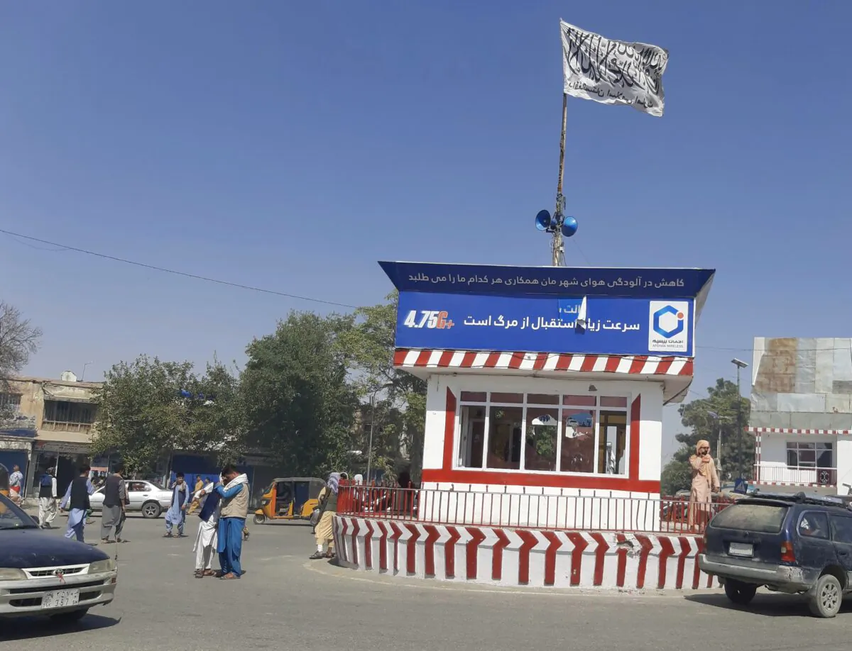 Taliban flag flies on the main square of Kunduz city after fighting between Taliban and Afghan security forces in Kunduz city, north of Kabul, Afghanistan, on Aug. 8, 2021. (Abdullah Sahil/AP Photo)