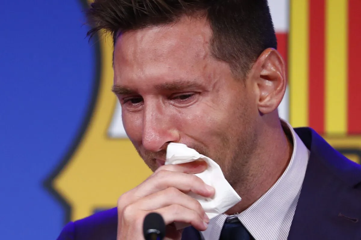 Lionel Messi cries at the start of a press conference at the Camp Nou stadium in Barcelona, Spain, on Aug. 8, 2021. (Joan Monfort/AP Photo)