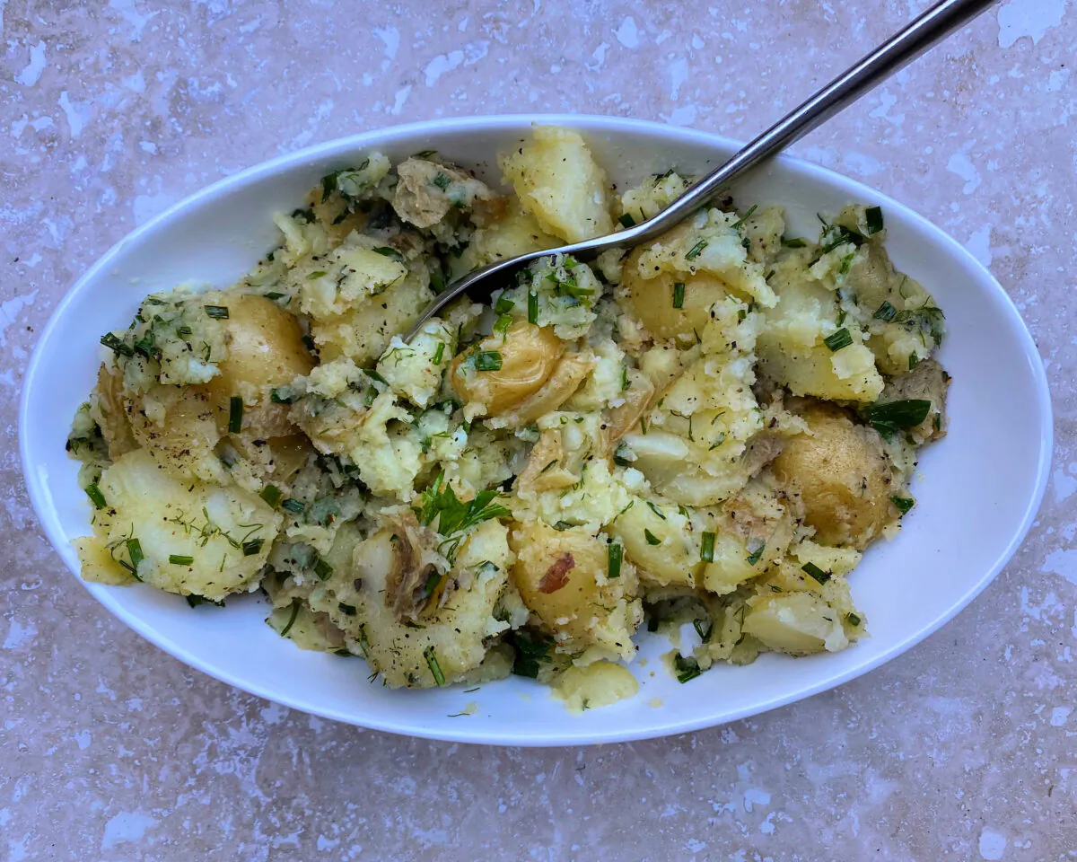 This European-style potato salad is light and bright, laced with vinegar and oil and tumbled with handfuls of fresh herbs. (Lynda Balslev for Tastefood)