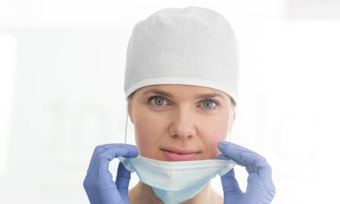 Surgical masks mainly protect patients from droplets from the surgeon and the surgeon from blood splatter from the patient. They were not designed to protect against viruses. (sirtravelalot/Shutterstock)