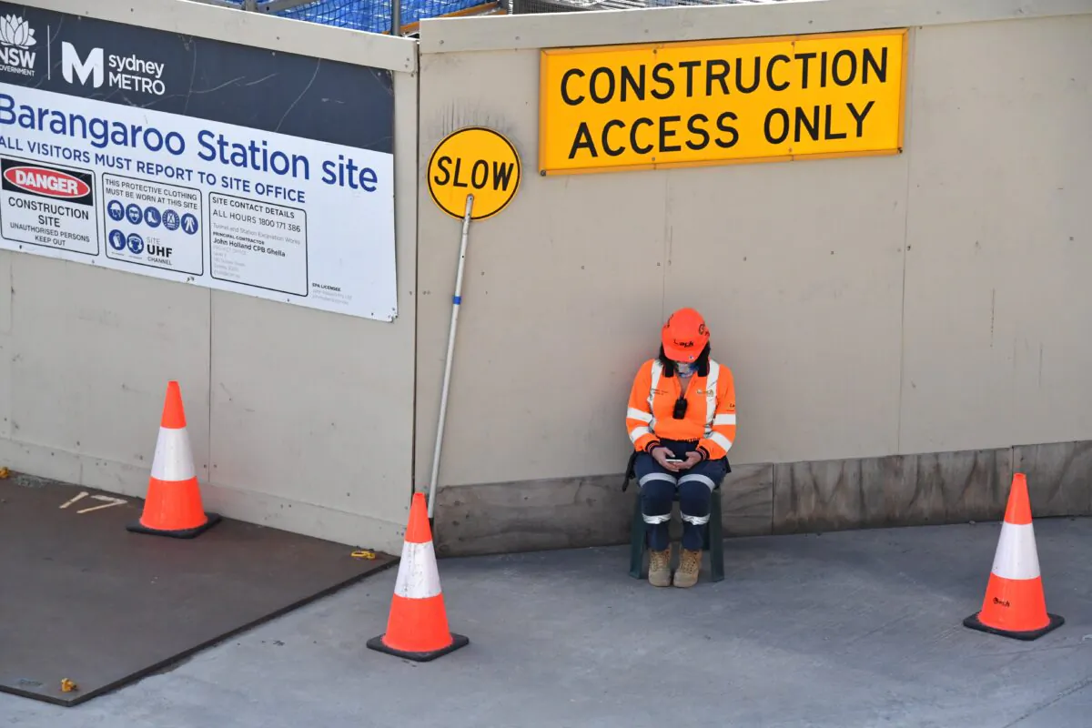 A construction worker is seen on a construction site at Barangaroo Point in Sydney, Australian, on Aug. 2, 2021. (AAP Image/Mick Tsikas)