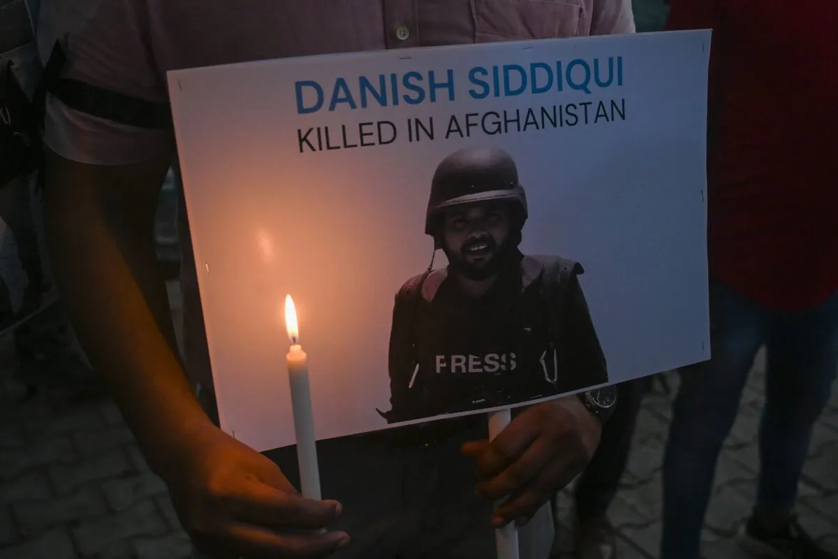Media personnel pay homage to Reuters journalist Danish Siddiqui at the press club in New Delhi on July 17, 2021, after the Pulitzer Prize-winning photographer was killed covering fighting between Afghan security forces and the Taliban near a border crossing with Pakistan, the media outlet reported, citing an army commander. (Prakash Singh/AFP via Getty Images)