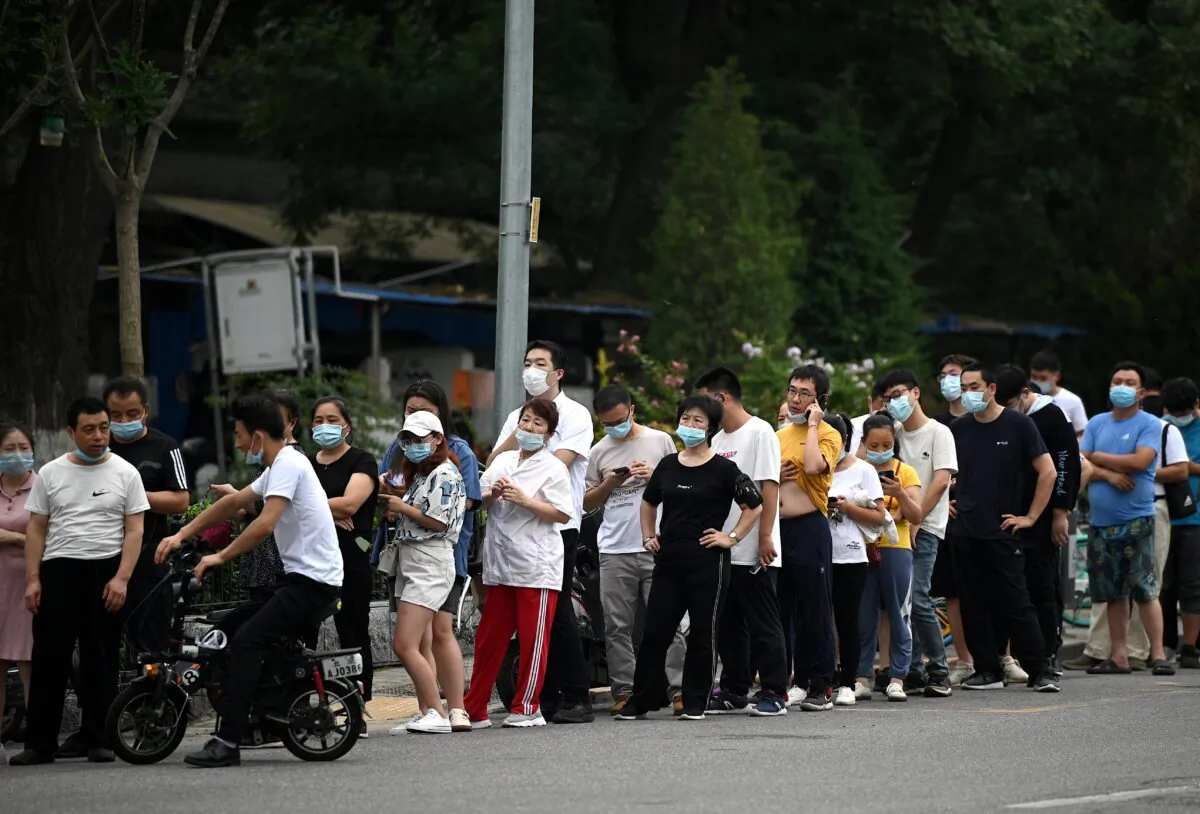 People queue to get tested for COVID-19 at a test site in Beijing, China on Aug. 5, 2021. (Noel Celis/AFP via Getty Images)