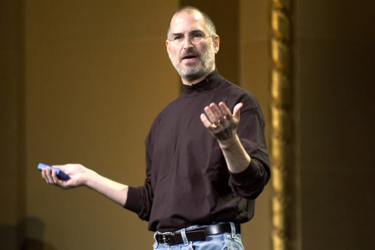 Steve Jobs of Apple Computer celebrates the release of a new Apple iPod family of products at the California Theatre in San Jose Calif., on Oct. 26, 2004. (Tim Mosenfelder/Getty Images)